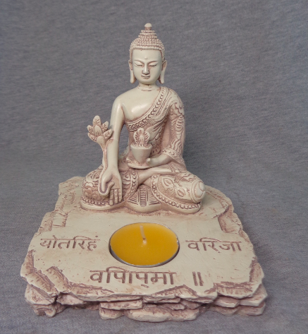 Buddha med fyrfadslys